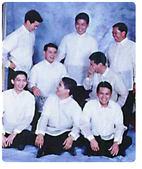 The second picture on the Pampanga limjocos page was taken during the wedding of my eldest brother Janssen. Those who are standing (from left to right) are abe Tayag, cousin in law; Janssen Limjoco, the groom; Ric Camitoc, another cousin in law.  Those who are kneeling (from left to right) are Jay-jay Limjoco and Larry Limjoco.  those who are sitting on the floor (left to right) are Jerome Limjoco, Tedd Limjoco--that's me!, and Francis limjoco.