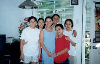 From left to right: Mama,Cristalle,Papa,Ate Camille,at the center is Ate Yvonne, daughter of Tita Elna,with her half brother.