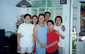 From left to right: Mama,Cristalle,Papa,Ate Camille,at the center is Ate Yvonne, daughter of Tita Elna,with her half brother. From left to right: Mama,Cristalle,Papa,Ate Camille,at the center is Ate Yvonne, daughter of Tita Elna,with her half brother.