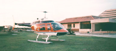 Chopper landing at helipad at Alex's house.
